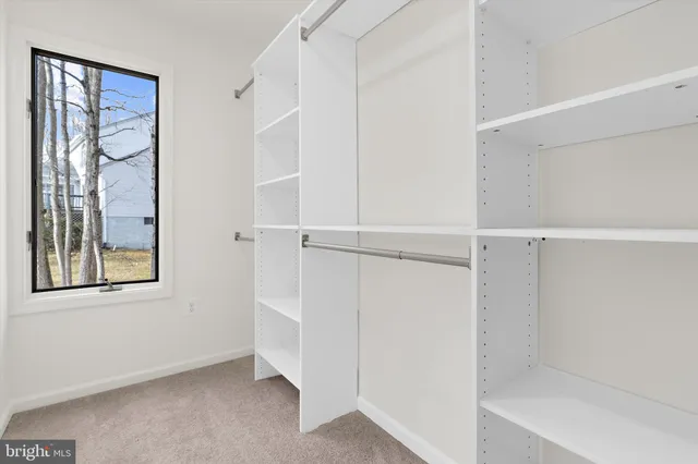 a bathroom with a sink vanity and a mirror