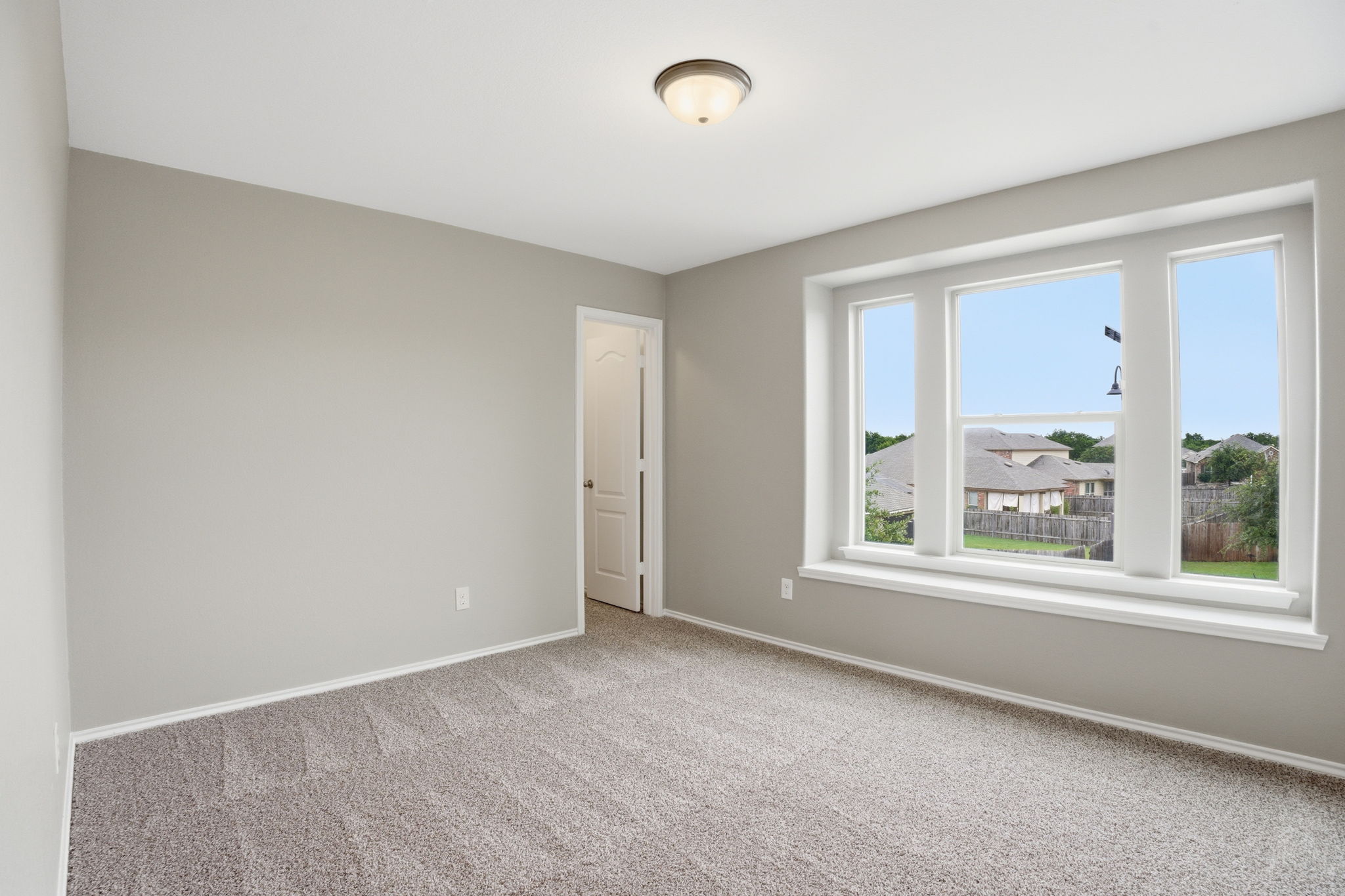 670 Landon Samuel Loop Pflugerville, TX 78660 - Photo 14 of 22 Neutral gray wall finishes with white trim
