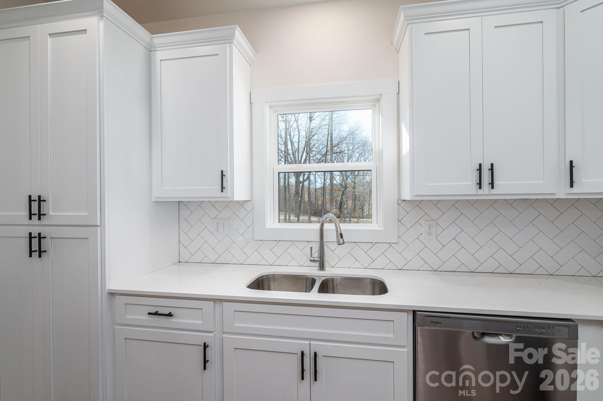 6335 Forney Hill Road Denver, NC 28037 - Photo 12 of 46 a kitchen with a sink cabinets and window