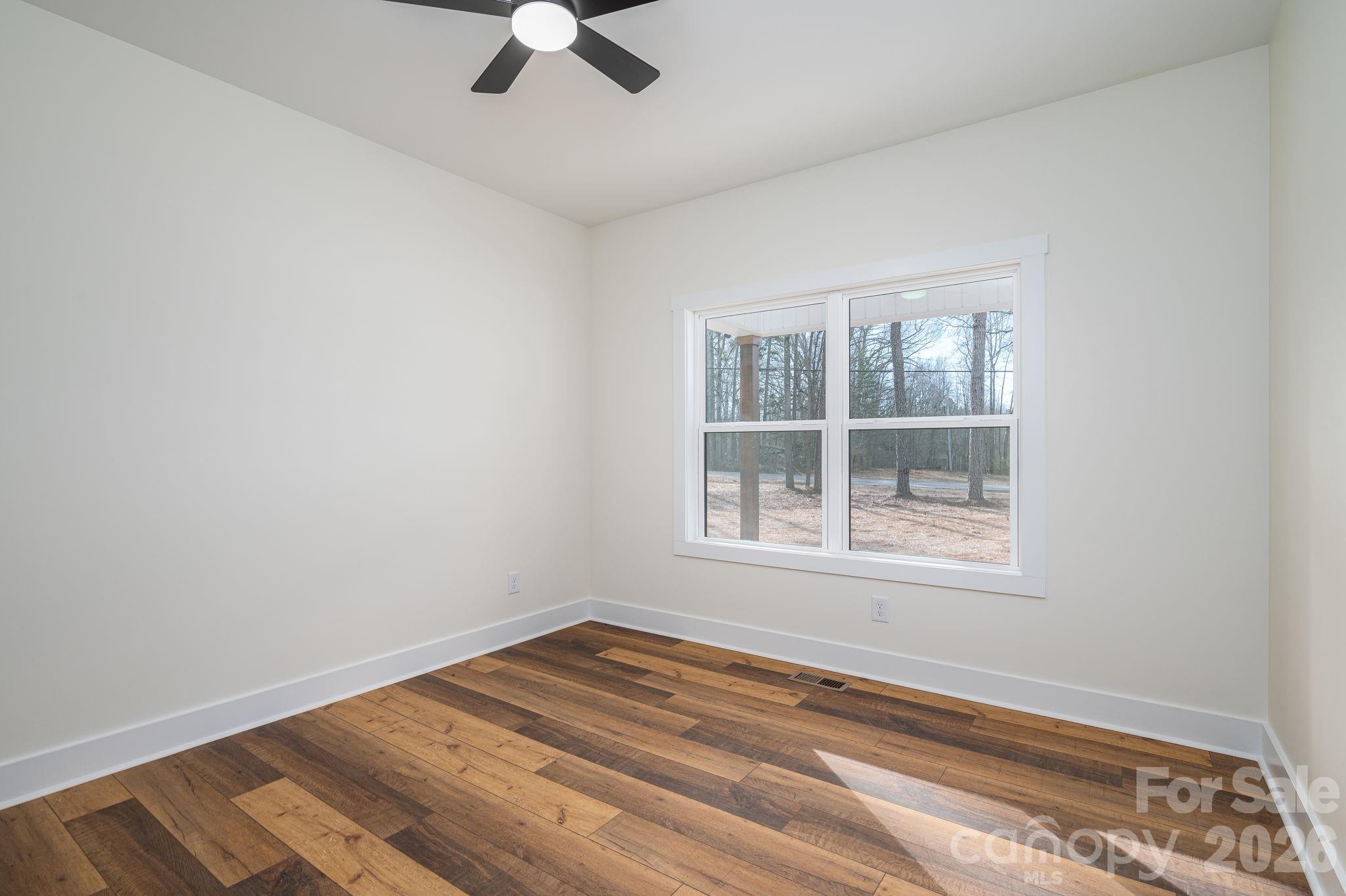6335 Forney Hill Road Denver, NC 28037 - Photo 23 of 46 an empty room with a window