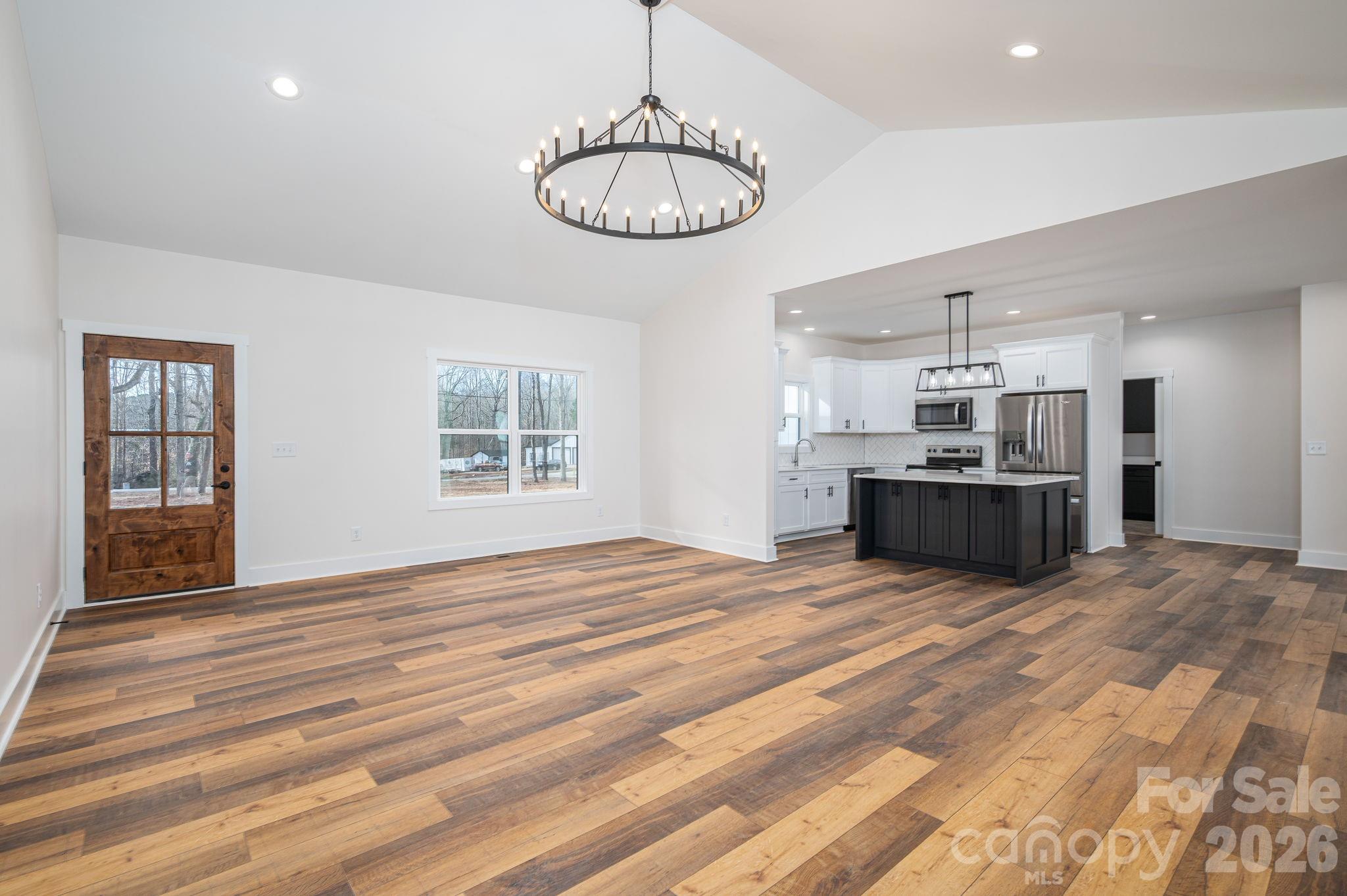 6335 Forney Hill Road Denver, NC 28037 - Photo 30 of 46 a view of kitchen and microwave with wooden floor