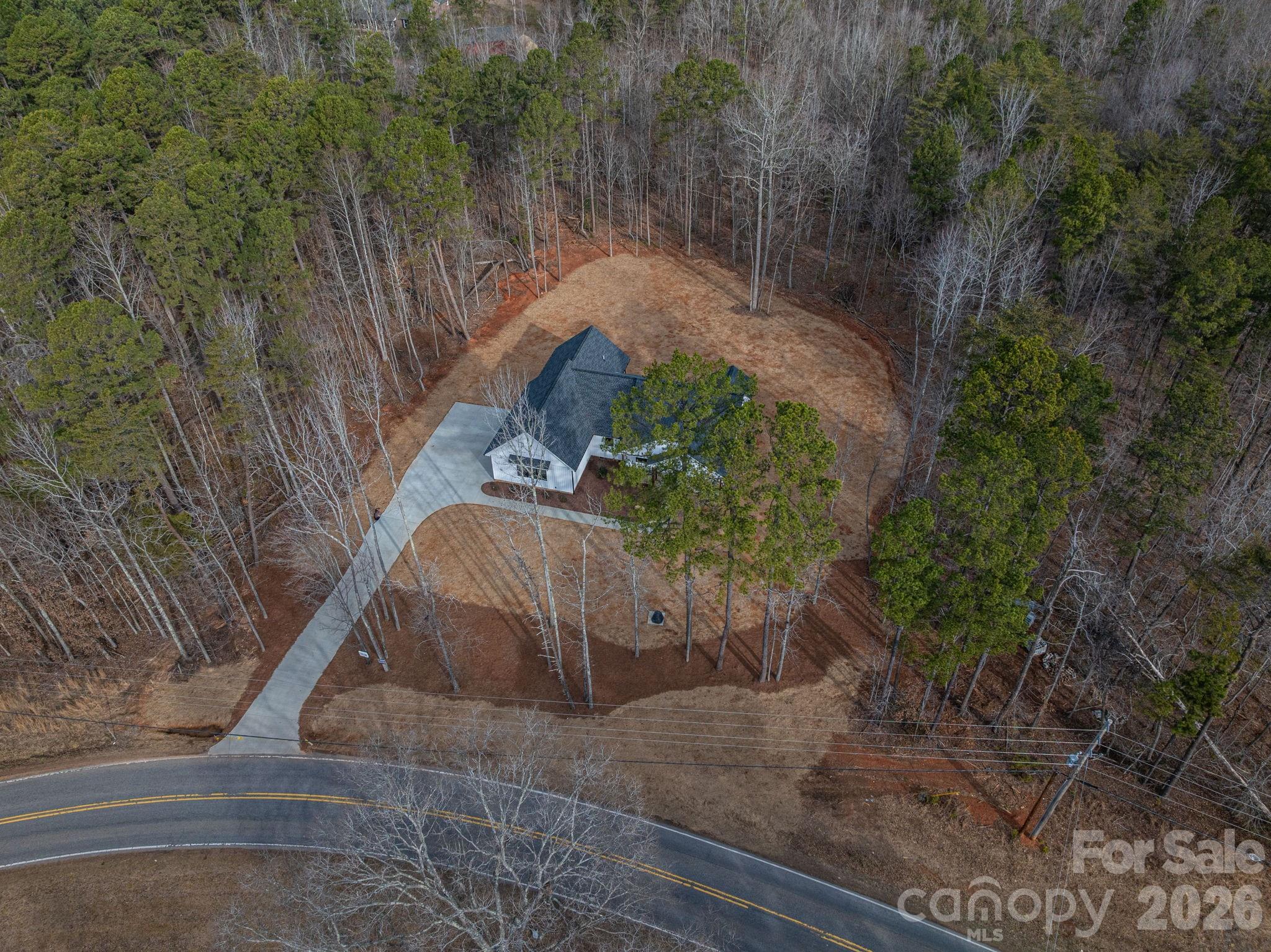 6335 Forney Hill Road Denver, NC 28037 - Photo 3 of 46 a view of a garden with a pathway