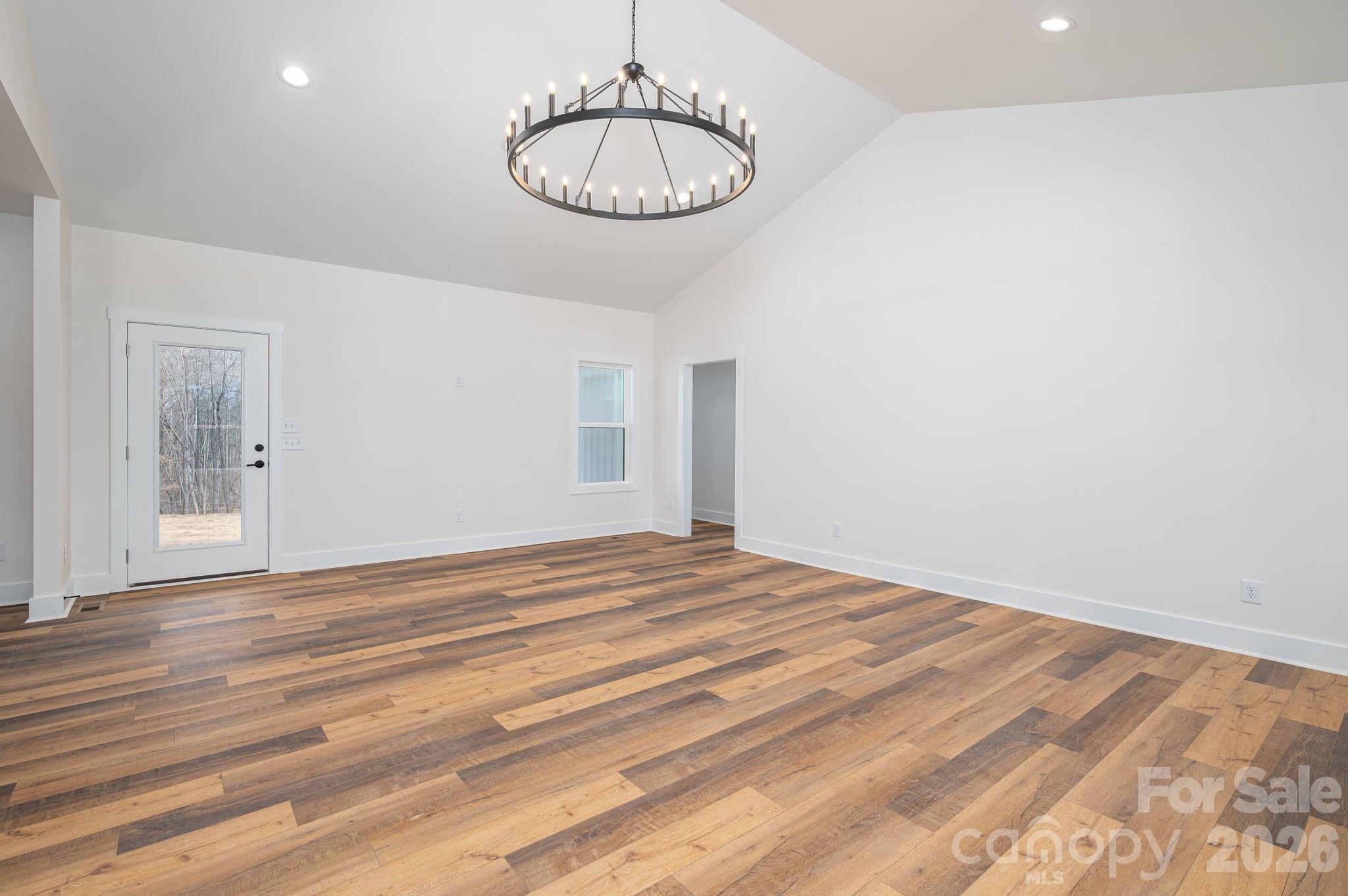 6335 Forney Hill Road Denver, NC 28037 - Photo 31 of 46 a view of empty room with wooden floor and fan