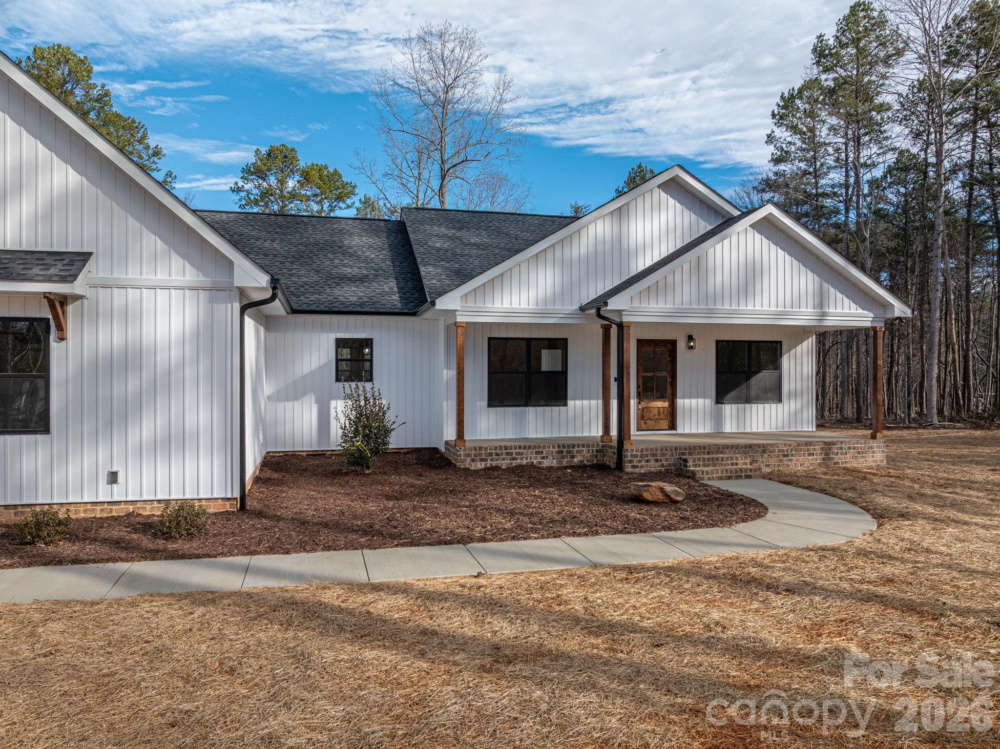 6335 Forney Hill Road Denver, NC 28037 - Photo 39 of 46 a front view of a house with garden