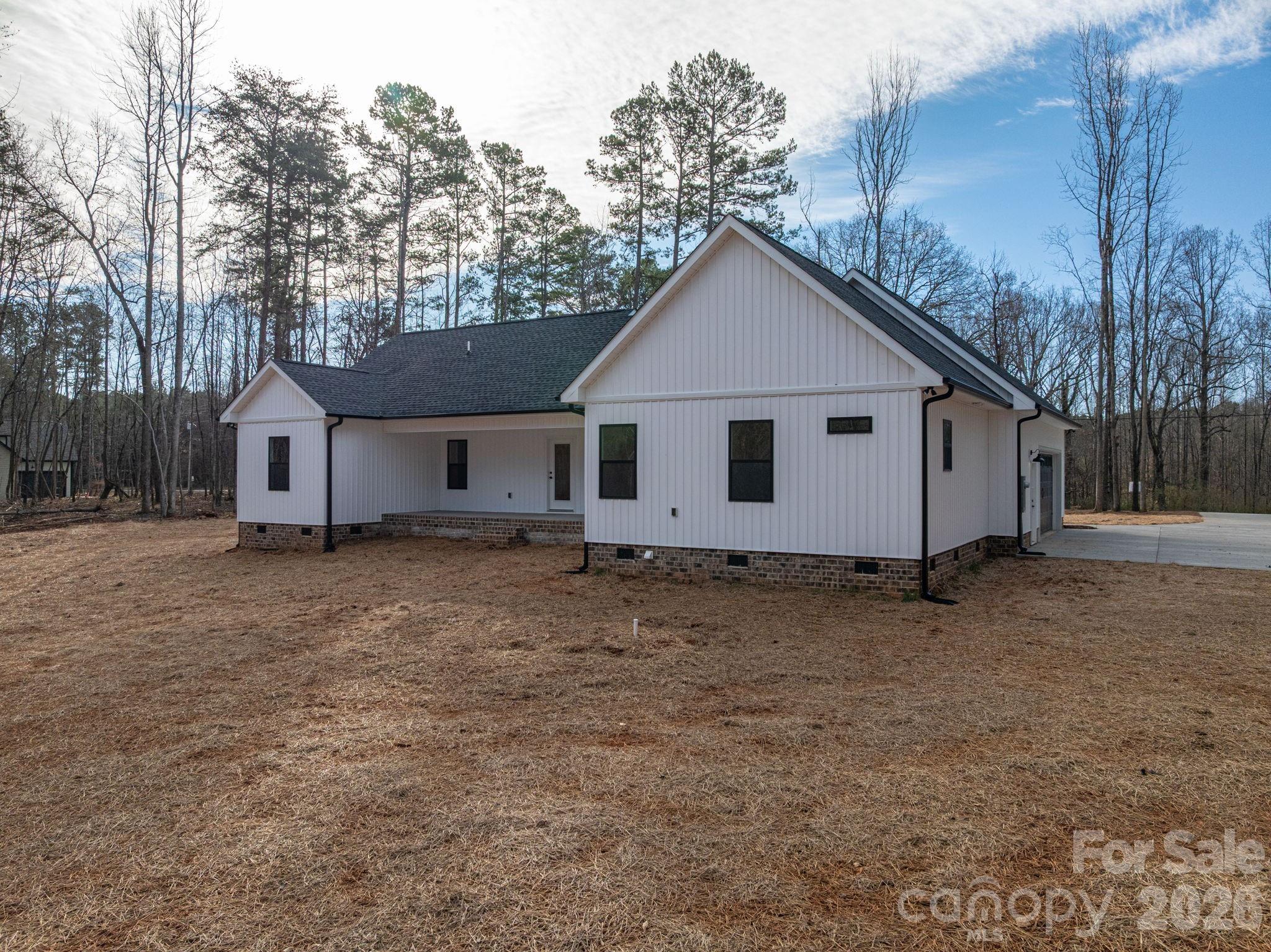 6335 Forney Hill Road Denver, NC 28037 - Photo 40 of 46 a view of a house with a yard and large tree