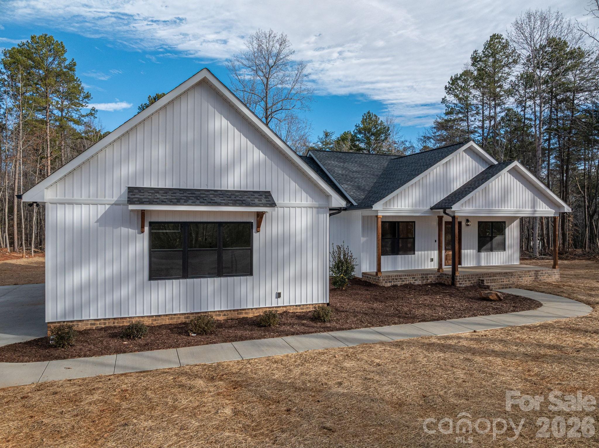 6335 Forney Hill Road Denver, NC 28037 - Photo 41 of 46 a front view of a house with a yard