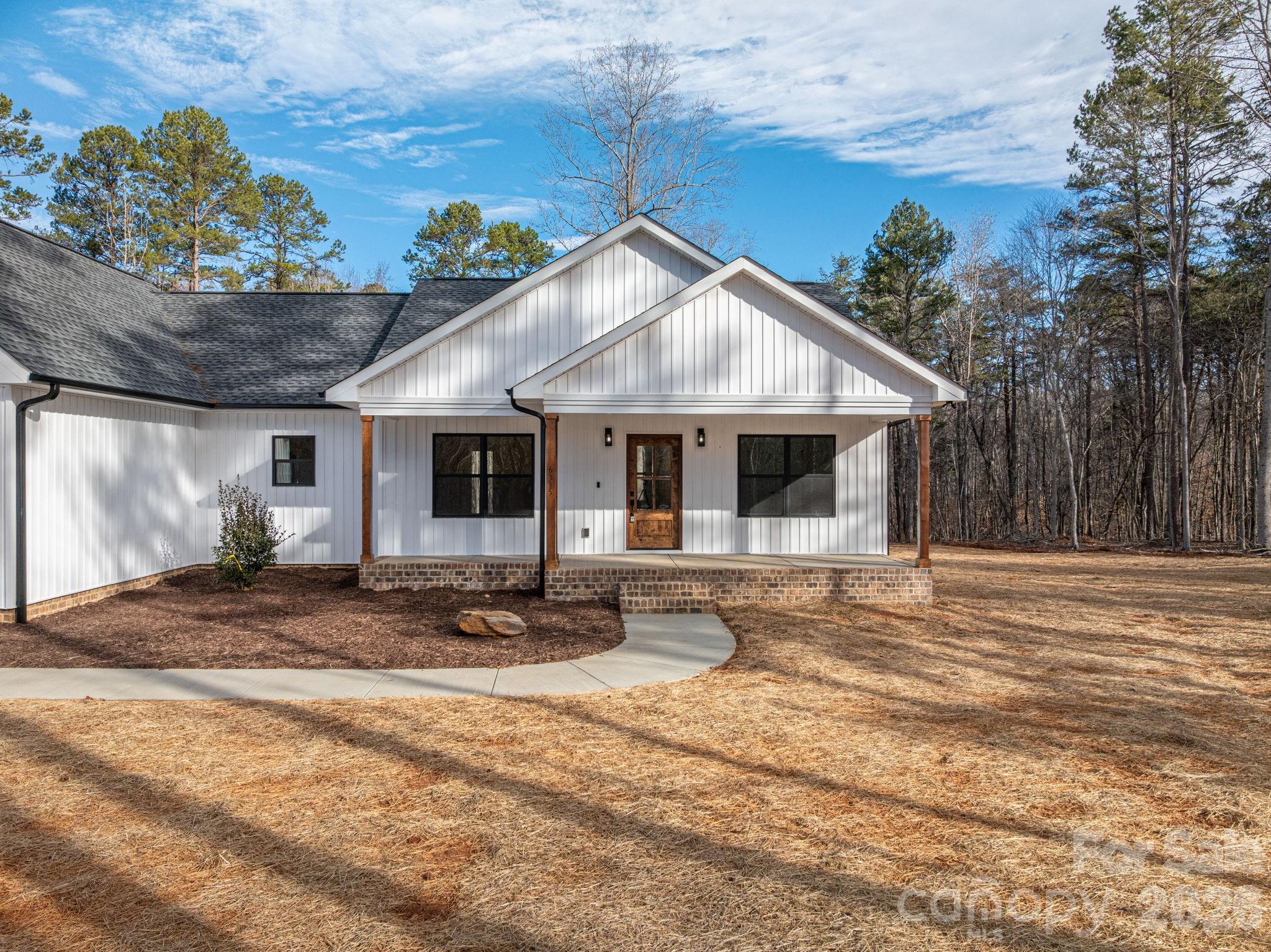 6335 Forney Hill Road Denver, NC 28037 - Photo 42 of 46 a front view of a house with a yard