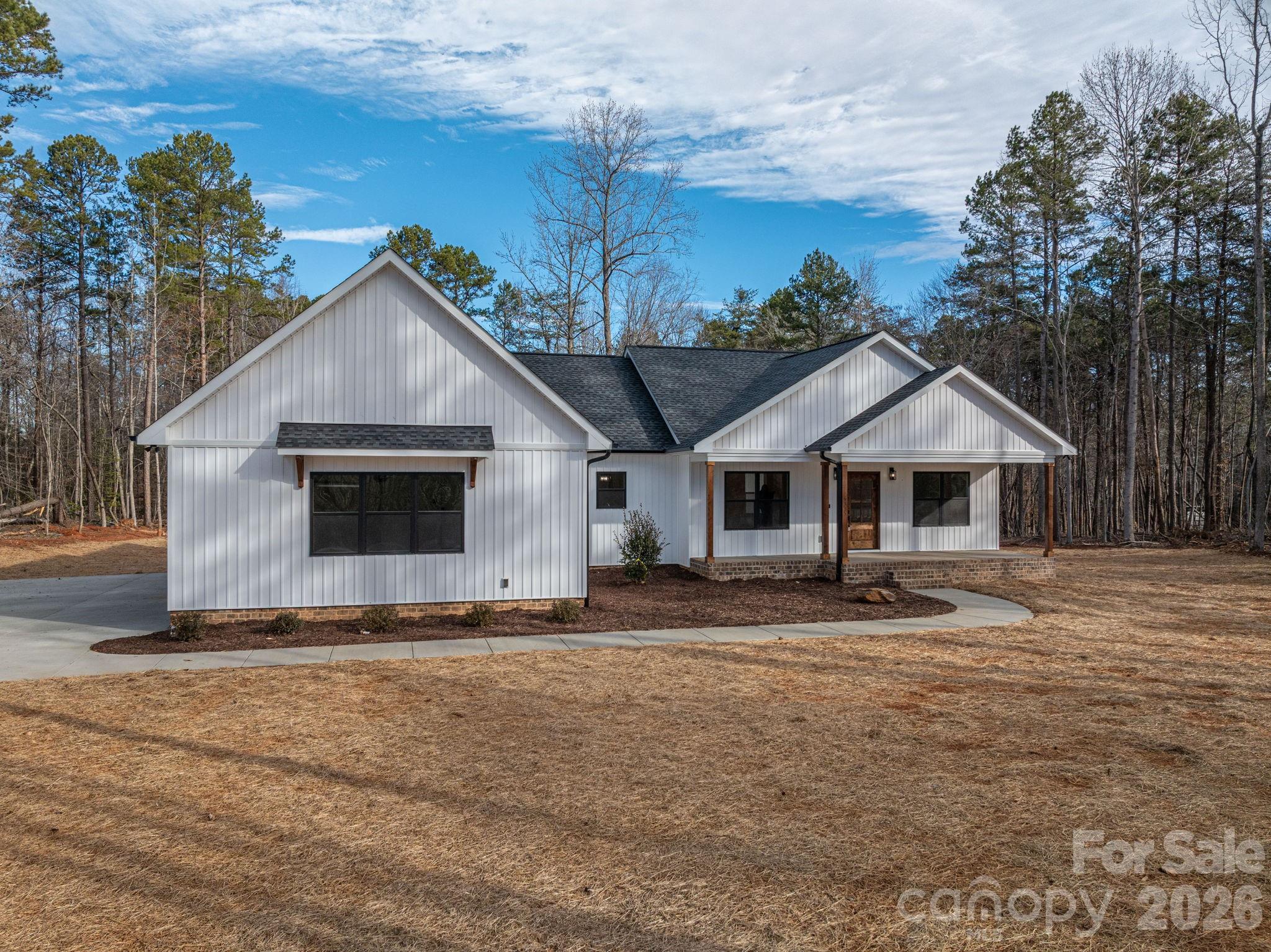 6335 Forney Hill Road Denver, NC 28037 - Photo 43 of 46 a front view of a house with a yard