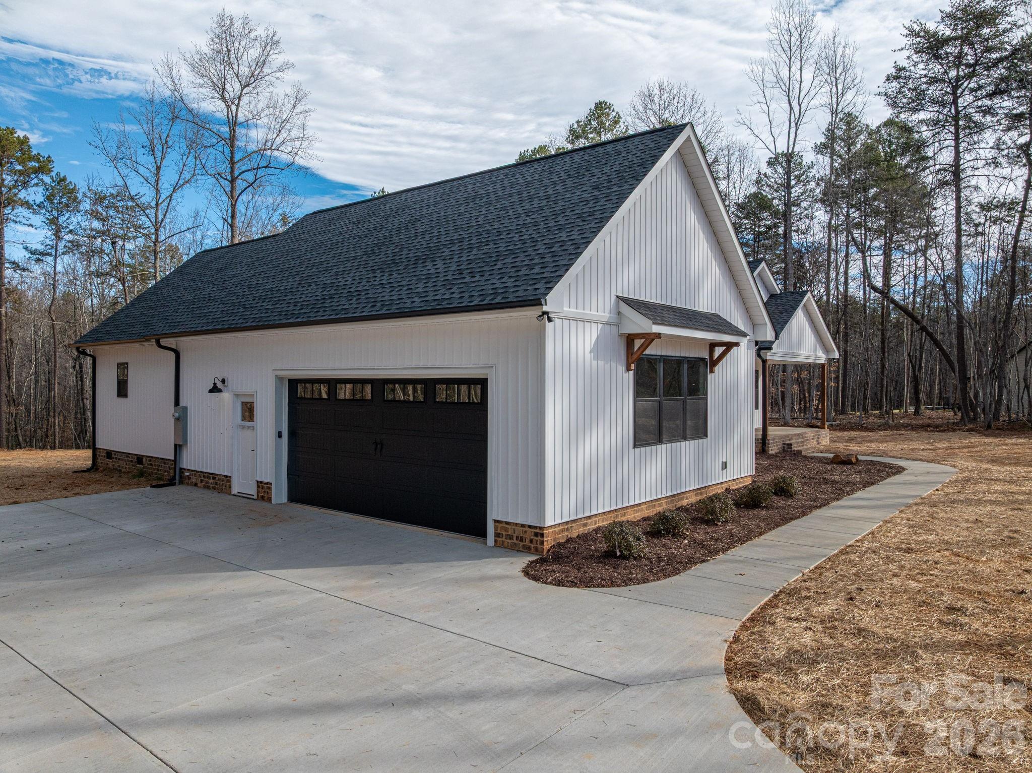6335 Forney Hill Road Denver, NC 28037 - Photo 5 of 46 a front view of house with garage
