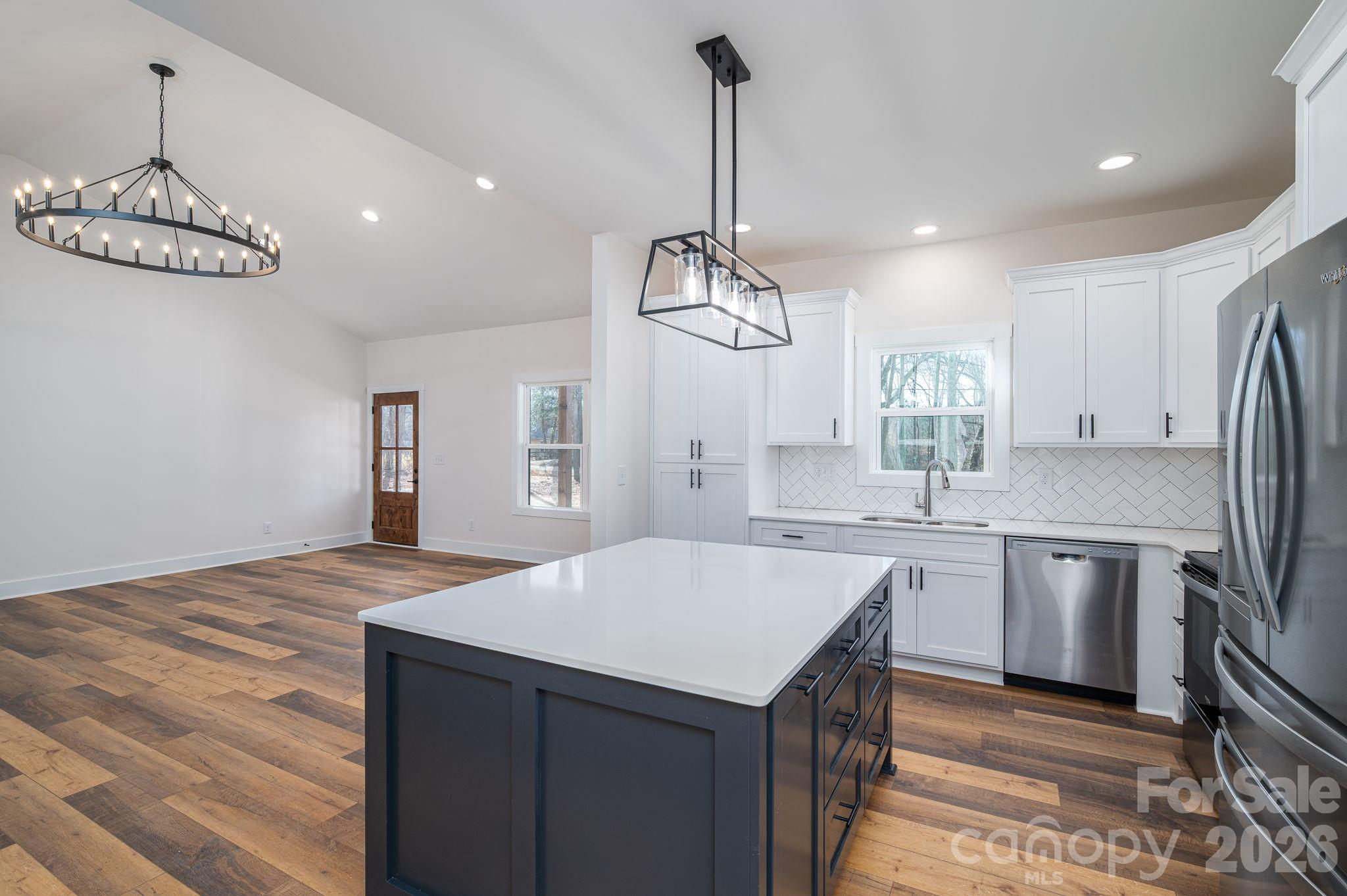 6335 Forney Hill Road Denver, NC 28037 - Photo 10 of 46 a kitchen with stainless steel appliances granite countertop a sink refrigerator and cabinets