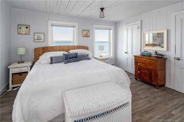 a bedroom with a bed and a closet