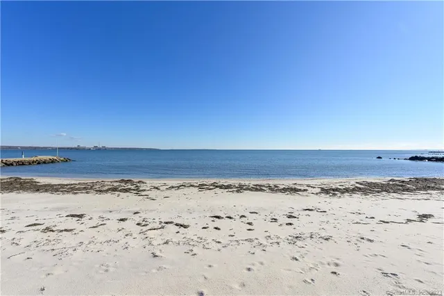 a front view of house with yard and outdoor seating