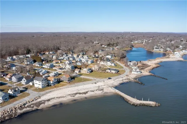 a view of street with a car parked on the road
