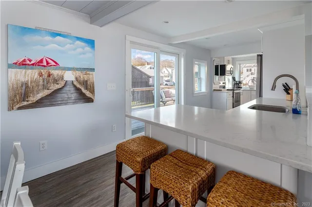 a view of a dining room with furniture and window