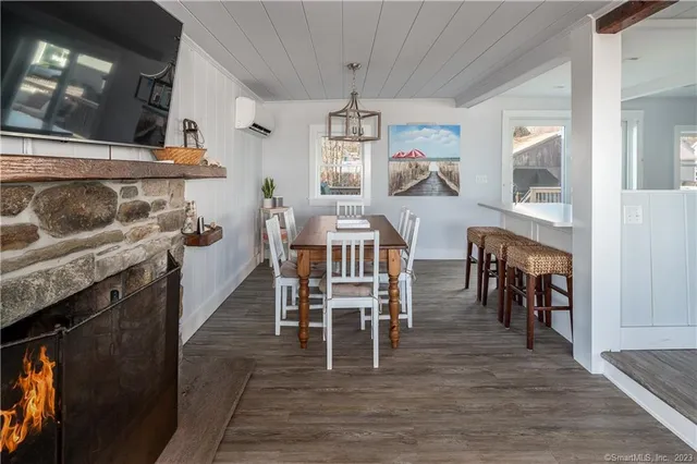 a dining room with furniture and window