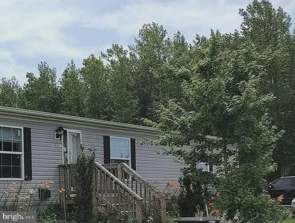 a view of a house with a tree