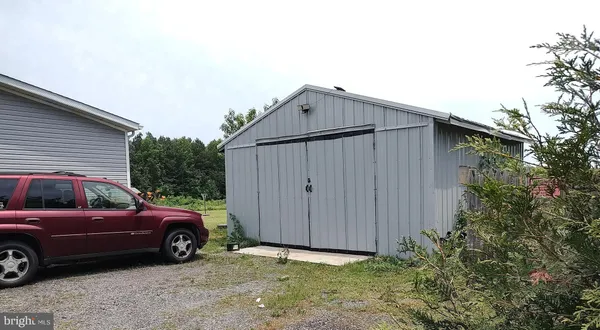 a view of a car parked in front of a house