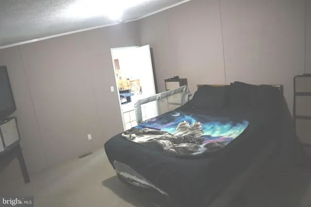 a room with a table and a fireplace