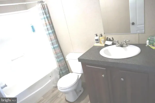 a bathroom with a sink mirror and vanity