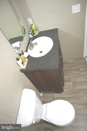 a view of a room with wooden floor