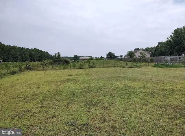 a view of a lake with houses in the back