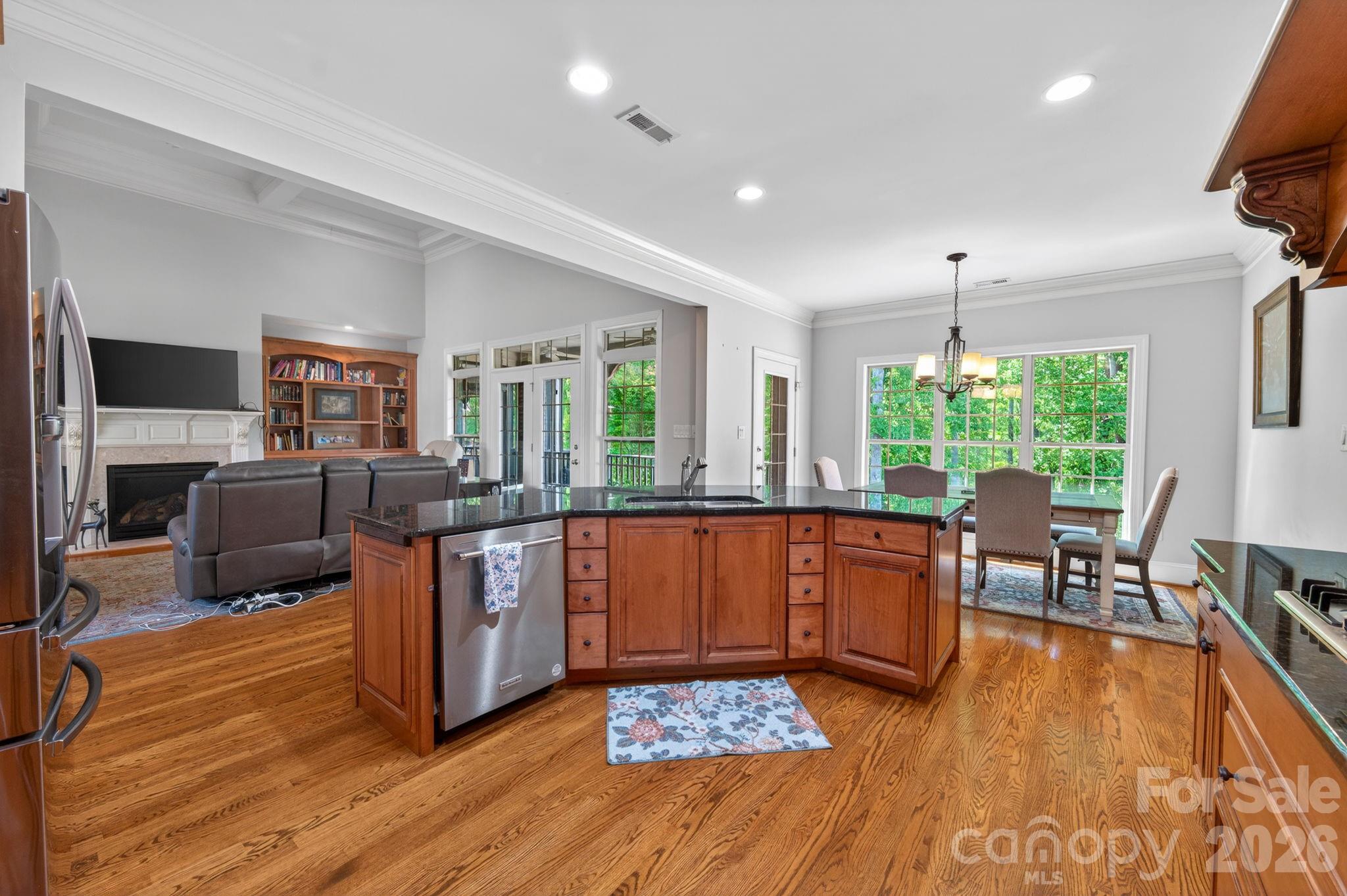 3138 Rappahannock Court, Unit 16 Matthews, NC 28104 - Photo 19 of 38 a living room with furniture and a wooden floor