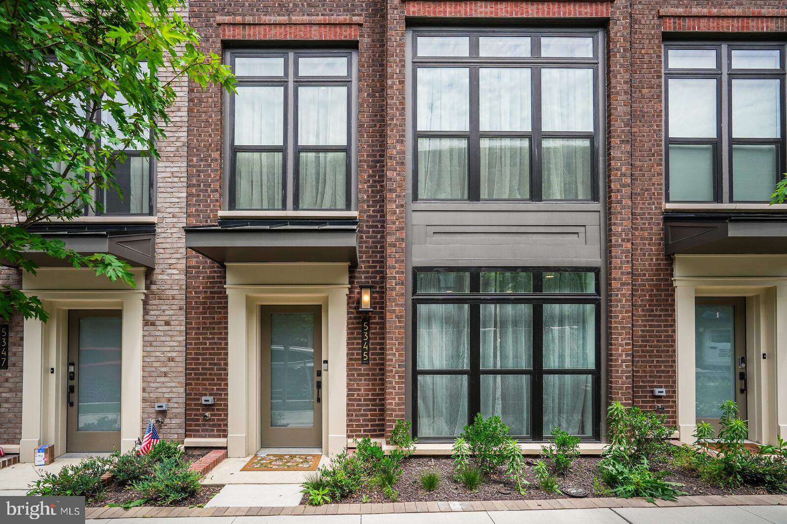 5345 Zenith Overlook Bethesda, MD 20816 - Photo 2 of 53 front view of a brick house with large windows