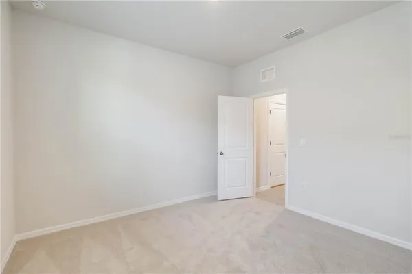 a view of an entryway with front door