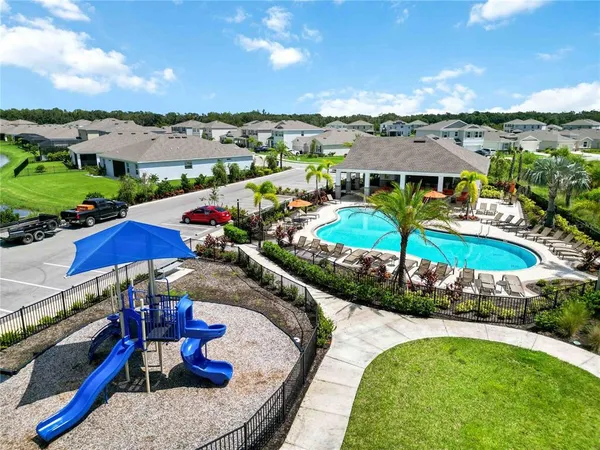 an aerial view of a house with big yard