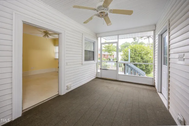 a view of n empty room with a window