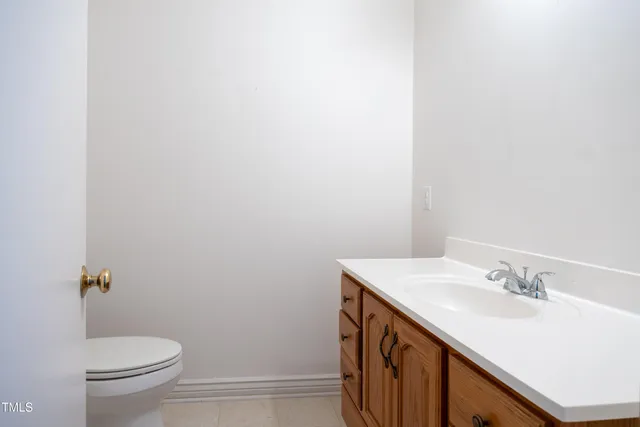 a bathroom with a sink toilet and vanity