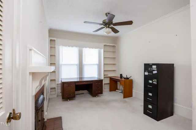 a view of a livingroom with furniture and a window