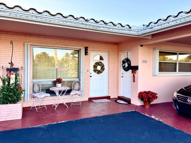 a living room with furniture a window and gym equipment