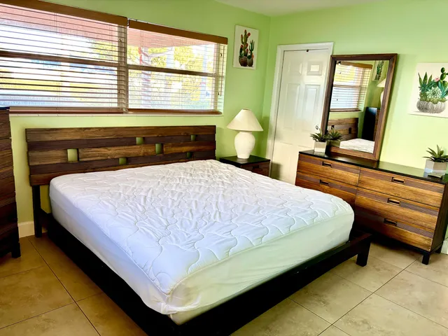 a bedroom with a bed and window