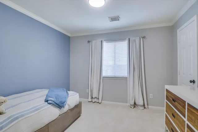 a room with a bed and a window