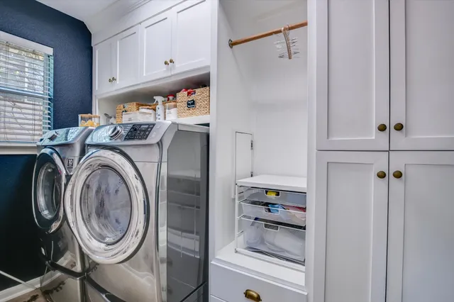 a spacious bedroom with a bed and a couch