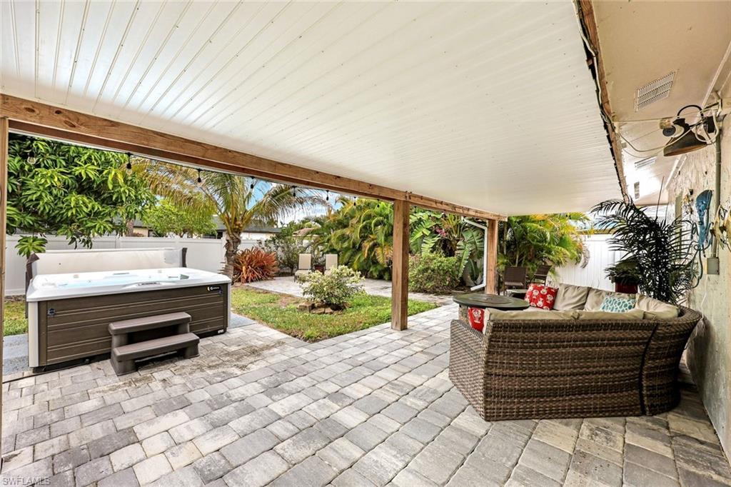 645 101st Avenue North Naples, FL 34108 - Photo 15 of 24 a sitting area with swimming pool in the backyard