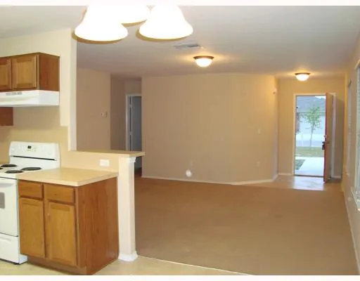 a kitchen with a sink cabinets and appliances