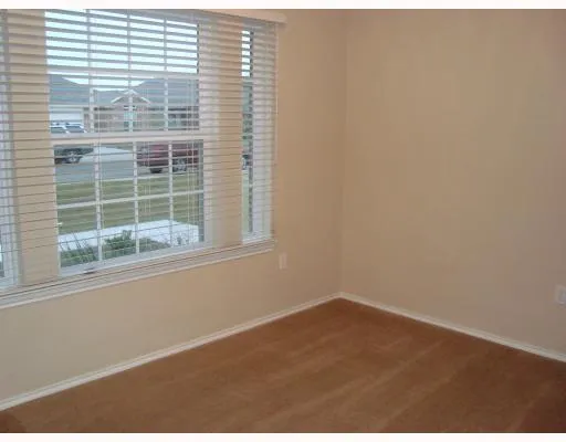 a view of empty room with windows