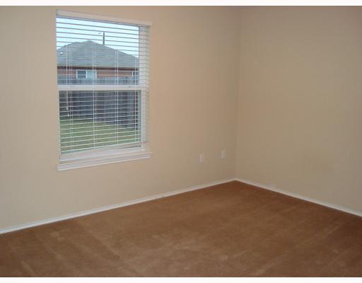 1519 Windy Oaks Drive Aransas Pass, TX 78336 - Photo 7 of 10 a view of an empty room with a window