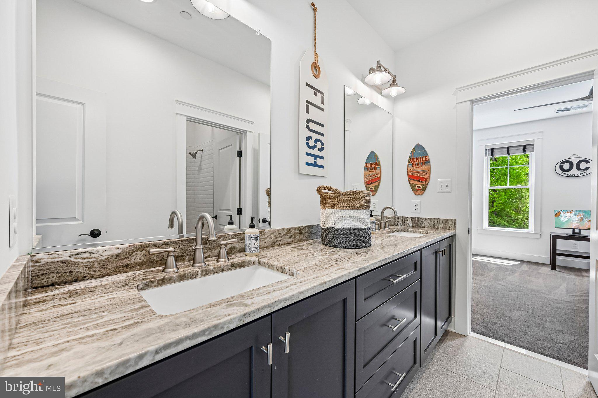 14516 Old Frederick Road Cooksville, MD 21723 - Photo 45 of 100 a bathroom with a granite countertop double vanity sink and a mirror