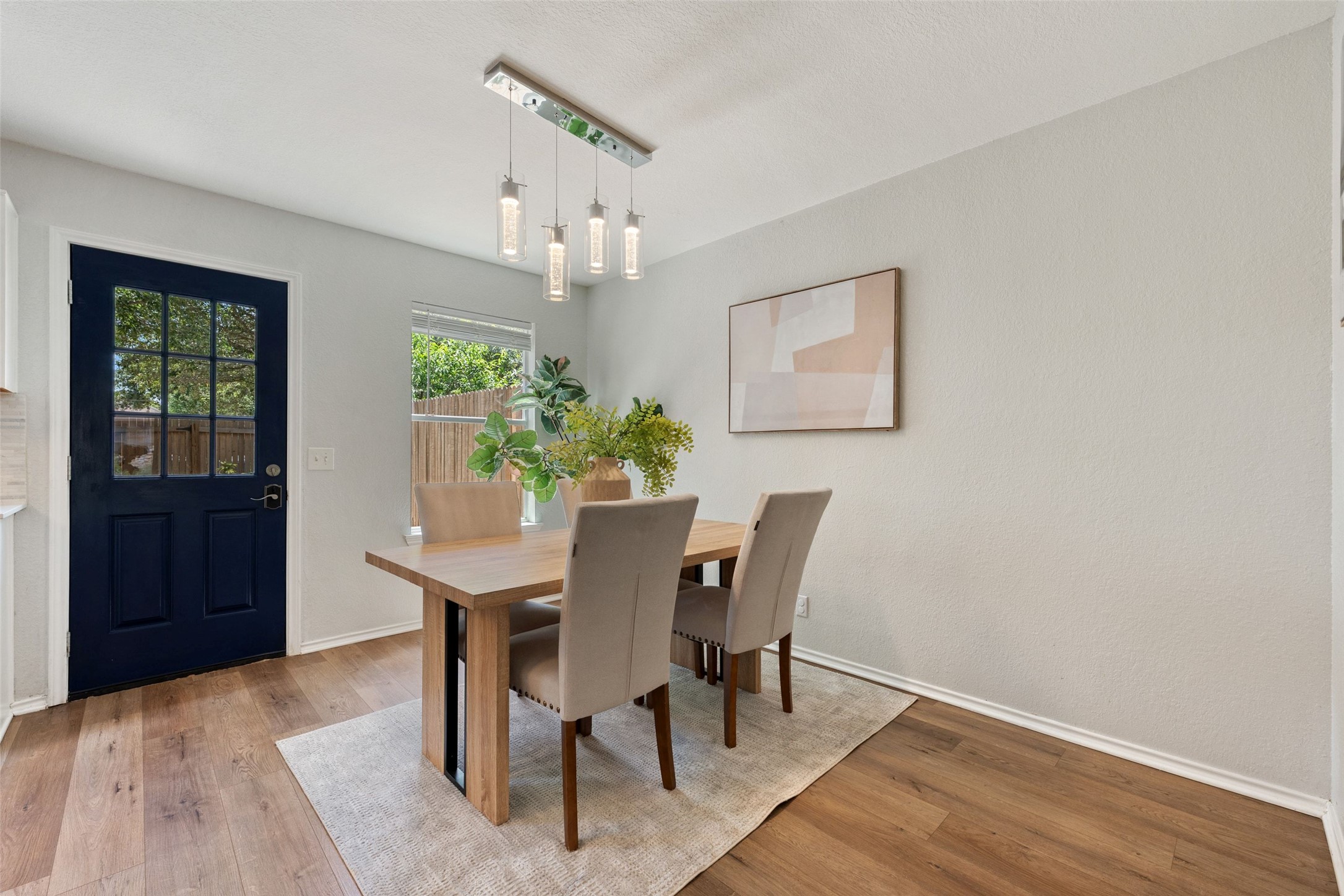 4529 Best Way Austin, TX 78725 - Photo 26 of 34 Dedicated dining area with large windows overlooking the private backyard