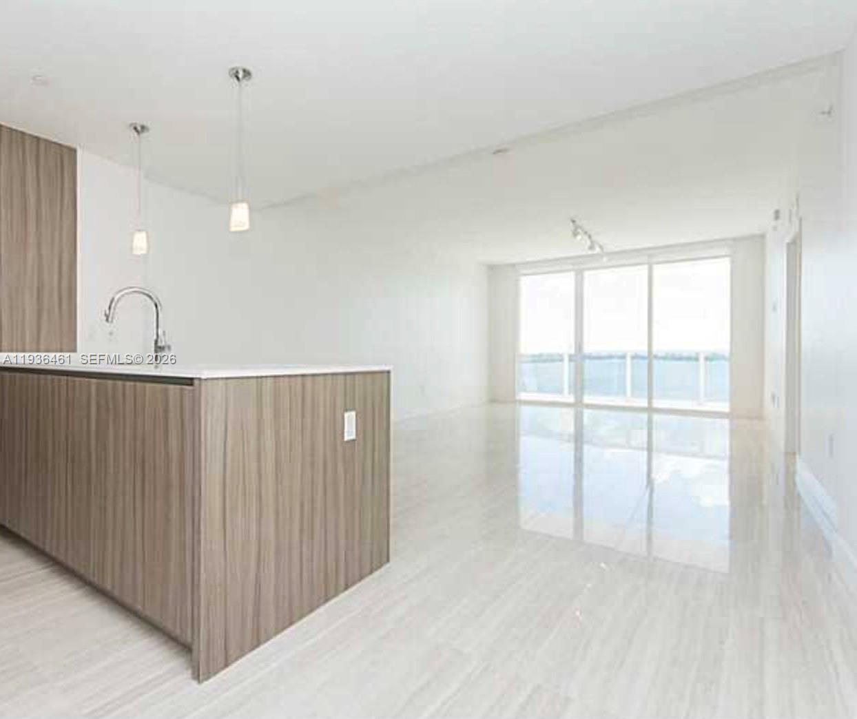 600 Northeast 27th Street, Unit 2004 Miami, FL 33137 - Photo 3 of 9 a view of an empty room with a window