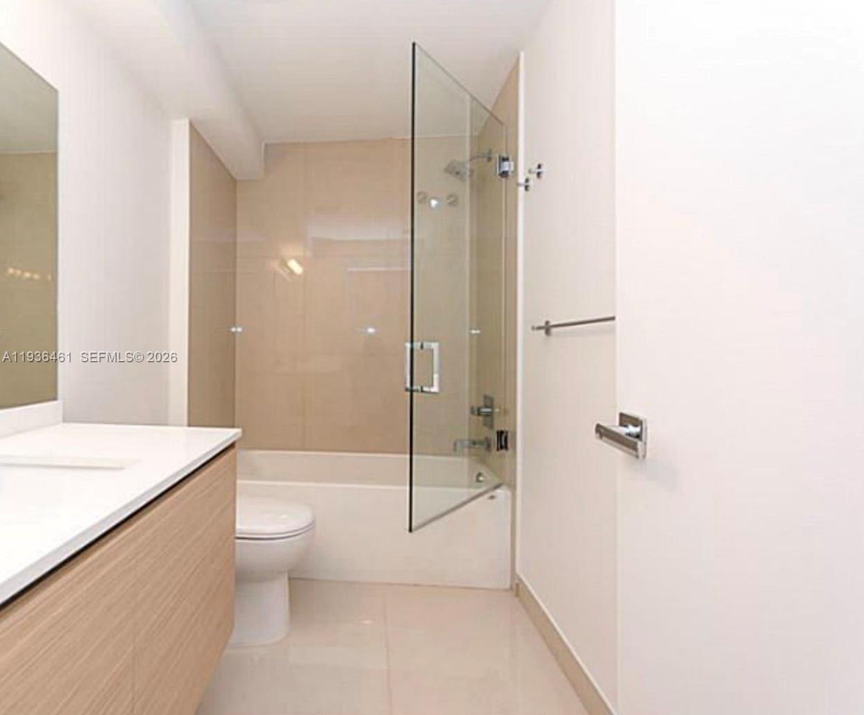 600 Northeast 27th Street, Unit 2004 Miami, FL 33137 - Photo 9 of 9 a bathroom with a shower a toilet and sink