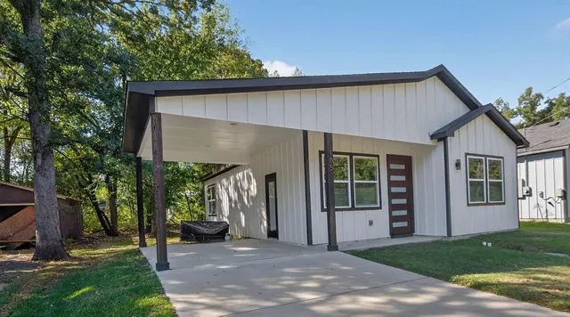 a house with trees in the background