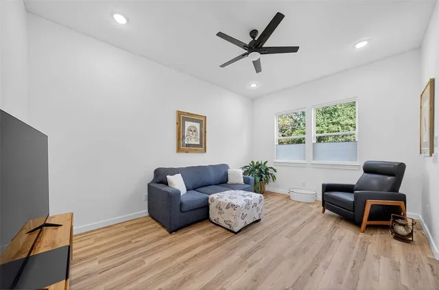 a living room with furniture and a window