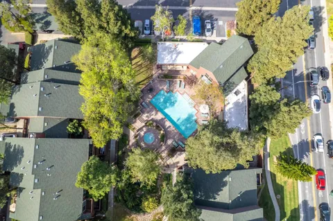 an aerial view of a house with a swimming pool