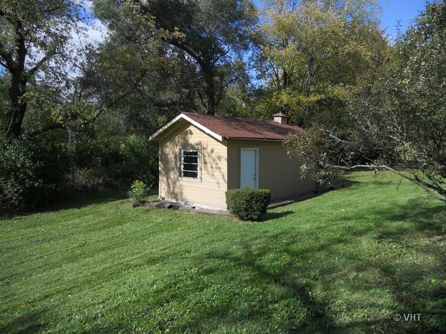 28W374 Roosevelt Road Winfield, IL 60190 - Photo 22 of 23 a view of a house with a yard