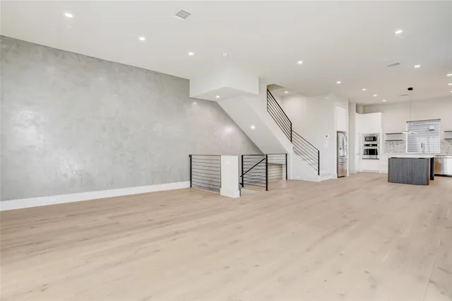 a living room with furniture and white walls