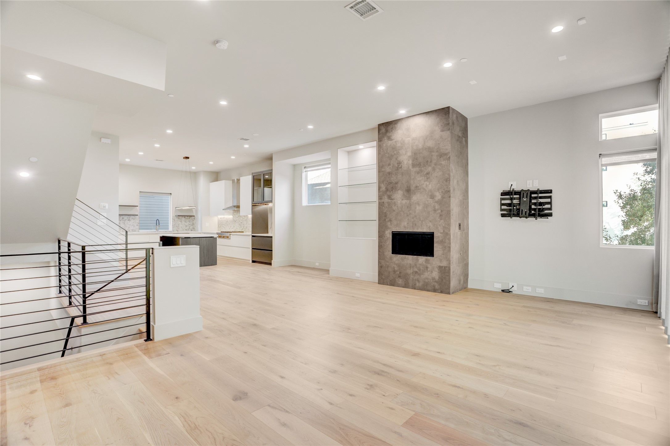 1116 Peden Street Houston, TX 77006 - Photo 22 of 48 Living Room Features a Stunning Electric Fireplace and Has Balcony Access